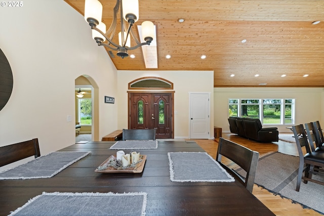 54601 Winterberry Dr, Bandon, OR 97411 - dining room with a chandelier, healthy amount of natural light, recessed lighting, arched walkways, and wood ceiling