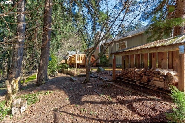 view of yard featuring a wooden deck