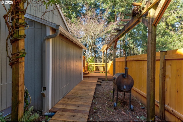 exterior space with fence and a deck