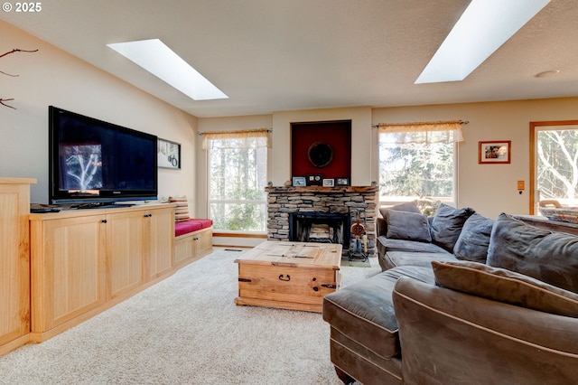 carpeted living room featuring a fireplace