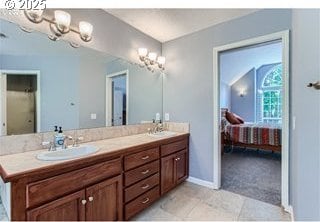 bathroom with tile patterned flooring and vanity