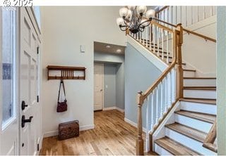 entrance foyer with a chandelier and hardwood / wood-style flooring