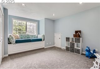 interior space featuring carpet flooring and baseboards