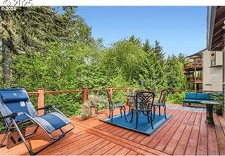 wooden deck with outdoor dining space