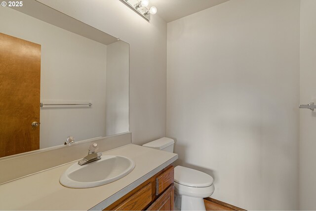 10915 SW Meadowbrook Dr Unit 22, Portland, OR 97224 - half bathroom featuring toilet and vanity