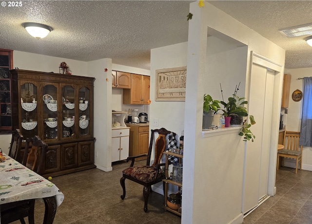 kitchen featuring a textured ceiling