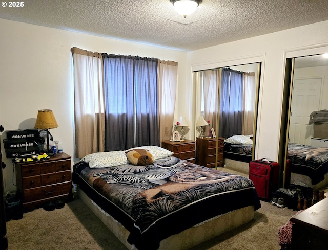 bedroom featuring a textured ceiling and carpet flooring