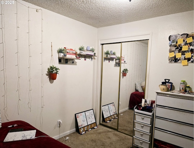 interior space with a textured ceiling and a closet