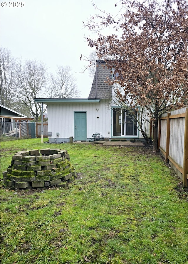 rear view of house with a lawn