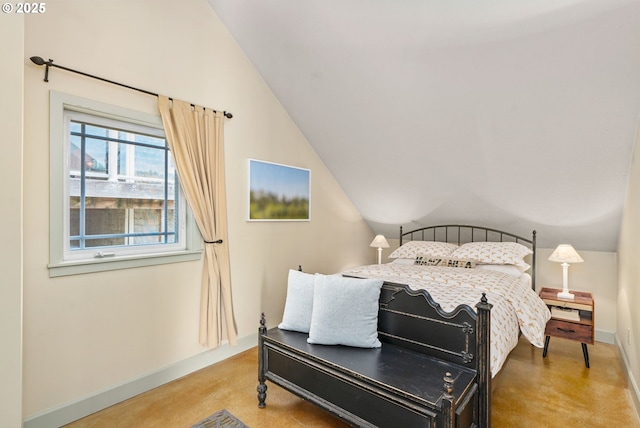 8917 Spindrift Ln, Manzanita, OR 97130 - bedroom with vaulted ceiling, baseboards, and concrete floors