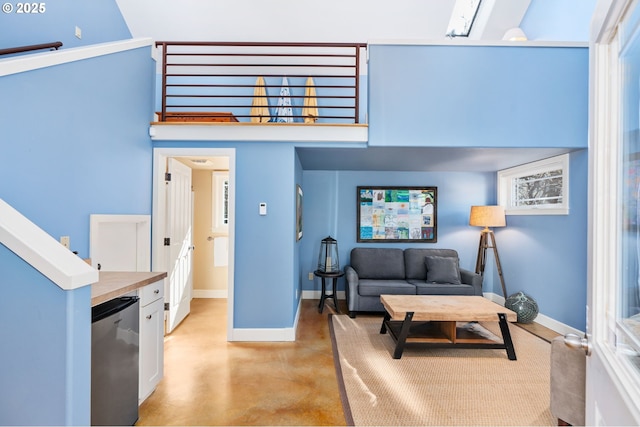 8917 Spindrift Ln, Manzanita, OR 97130 - living area with concrete floors and baseboards