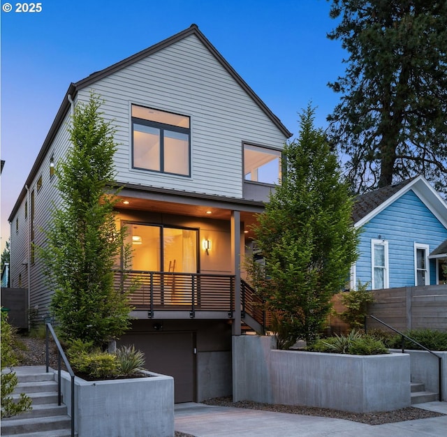 3770 NE 7th Ave, Portland, OR 97212 - view of front facade with stairs, concrete driveway, and a garage