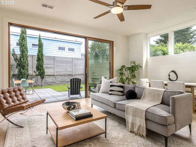 3770 NE 7th Ave, Portland, OR 97212 - living room with ceiling fan and light wood-style flooring
