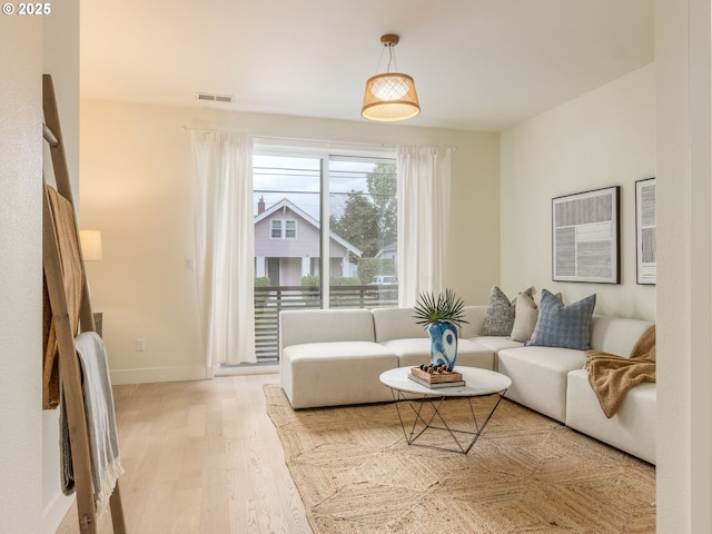 3770 NE 7th Ave, Portland, OR 97212 - living area featuring light wood-type flooring and baseboards