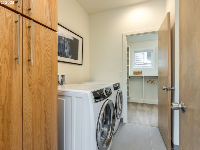 3770 NE 7th Ave, Portland, OR 97212 - laundry area with cabinet space, washing machine and dryer, tile patterned floors, and carpet floors