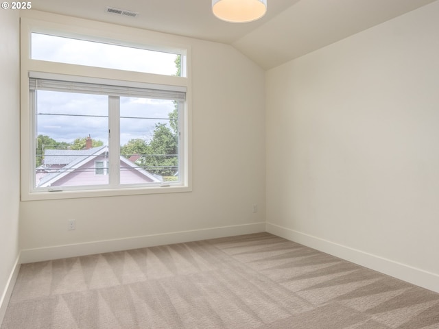 3770 NE 7th Ave, Portland, OR 97212 - spare room with light carpet, baseboards, and lofted ceiling