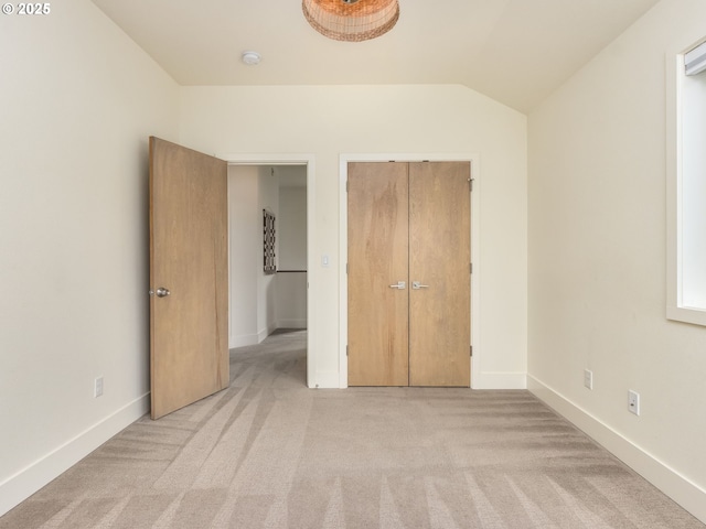 3770 NE 7th Ave, Portland, OR 97212 - unfurnished bedroom with light colored carpet, vaulted ceiling, and baseboards