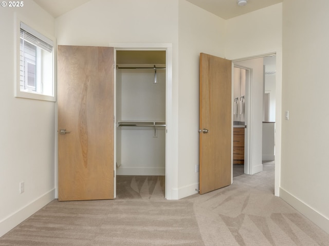 3770 NE 7th Ave, Portland, OR 97212 - unfurnished bedroom featuring a closet, carpet floors, baseboards, and a walk in closet