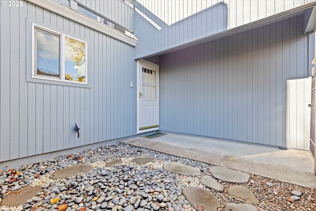 entrance to property with a patio