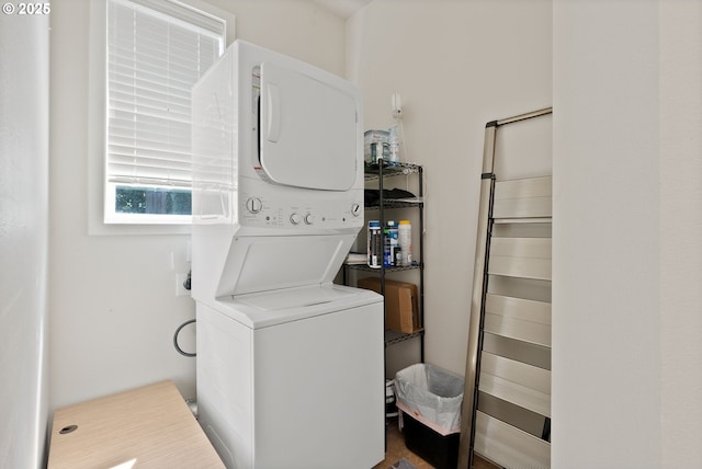 laundry room featuring estacked washer and dryer
