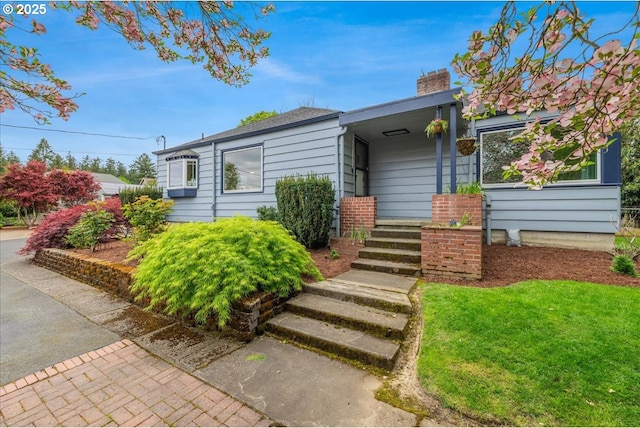 3400 SW 110th Ave, Beaverton, OR 97005 - view of front of house featuring a chimney and a front lawn