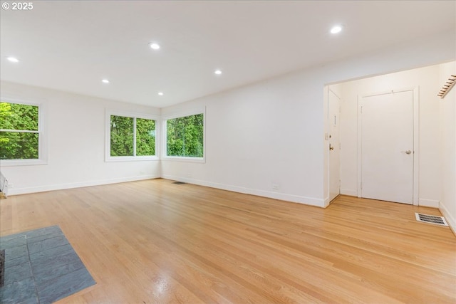 3400 SW 110th Ave, Beaverton, OR 97005 - unfurnished living room with visible vents, recessed lighting, light wood finished floors, and baseboards