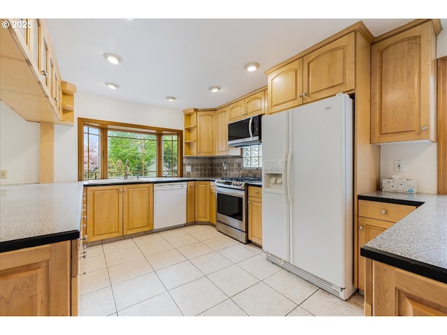 kitchen featuring tasteful backsplash, open shelves, a sink, stainless steel appliances, and light tile patterned flooring