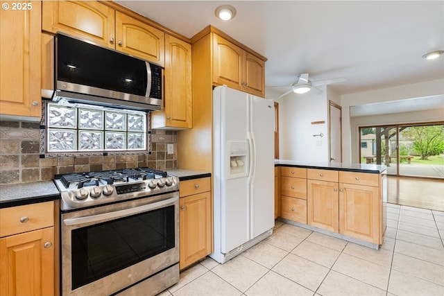 3400 SW 110th Ave, Beaverton, OR 97005 - kitchen with tasteful backsplash, stainless steel appliances, a peninsula, and ceiling fan