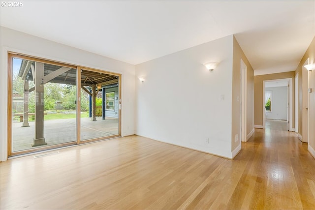 3400 SW 110th Ave, Beaverton, OR 97005 - empty room featuring baseboards and light wood finished floors