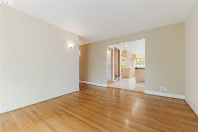 3400 SW 110th Ave, Beaverton, OR 97005 - spare room with baseboards and light wood-style flooring