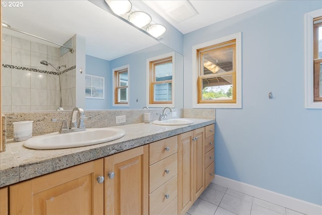 3400 SW 110th Ave, Beaverton, OR 97005 - bathroom featuring double vanity, tiled shower, a sink, and tile patterned flooring