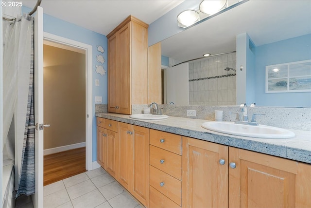 3400 SW 110th Ave, Beaverton, OR 97005 - bathroom featuring double vanity, curtained shower, a sink, and tile patterned flooring