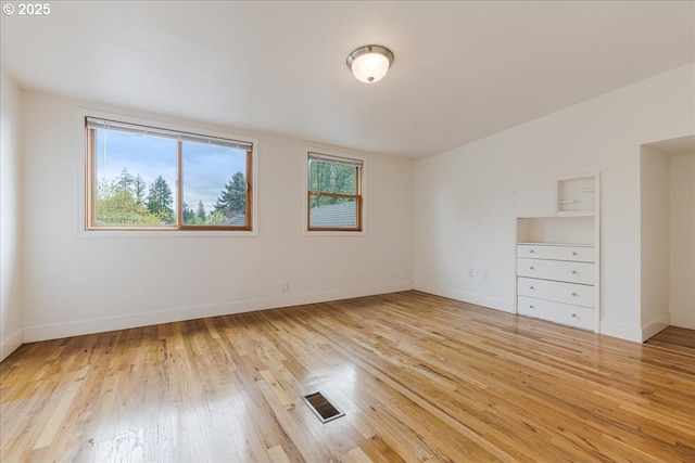 3400 SW 110th Ave, Beaverton, OR 97005 - empty room with baseboards, visible vents, and light wood-style flooring