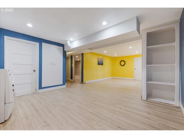 basement featuring recessed lighting, baseboards, and light wood-type flooring