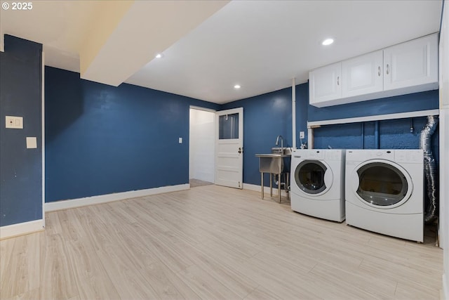 3400 SW 110th Ave, Beaverton, OR 97005 - laundry area featuring cabinet space, recessed lighting, baseboards, light wood-type flooring, and washer and clothes dryer