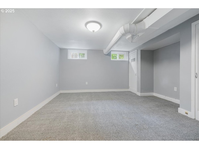 basement with carpet floors and baseboards