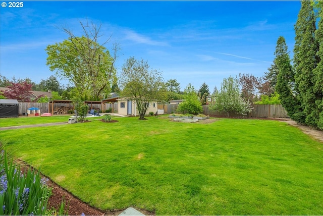 3400 SW 110th Ave, Beaverton, OR 97005 - view of yard with a patio, a fenced backyard, and an outbuilding