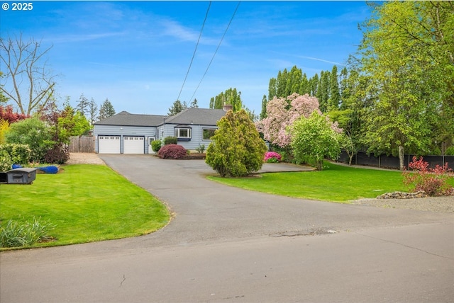 3400 SW 110th Ave, Beaverton, OR 97005 - ranch-style home with fence, an attached garage, a front yard, and aphalt driveway