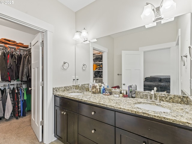 924 Park St, Sweet Home, OR 97386 - bathroom with a walk in closet, a sink, and double vanity