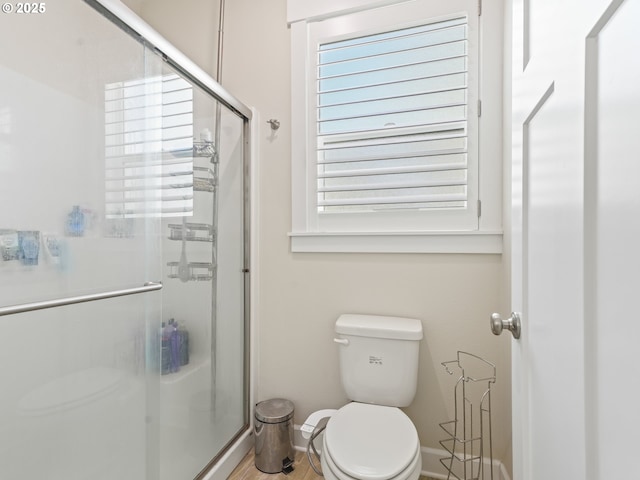 924 Park St, Sweet Home, OR 97386 - bathroom featuring plenty of natural light, baseboards, toilet, and a stall shower