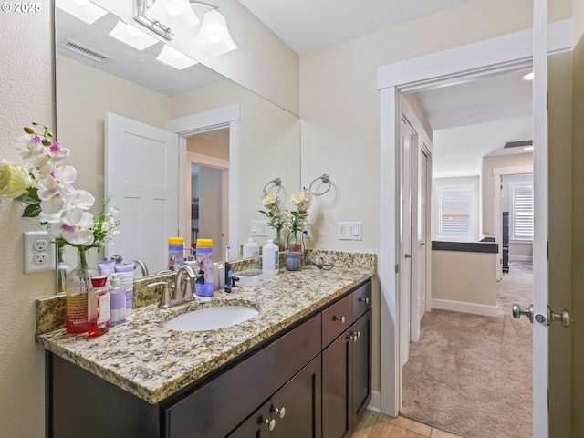 924 Park St, Sweet Home, OR 97386 - bathroom with baseboards, visible vents, and vanity
