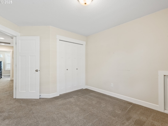 924 Park St, Sweet Home, OR 97386 - unfurnished bedroom featuring baseboards, carpet flooring, and a closet