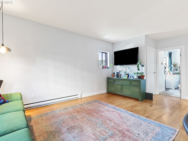 living room featuring hardwood / wood-style flooring and a baseboard radiator