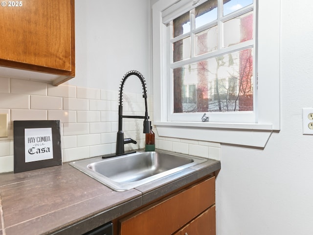 kitchen with sink and tasteful backsplash