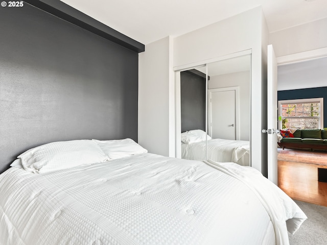 carpeted bedroom with a closet