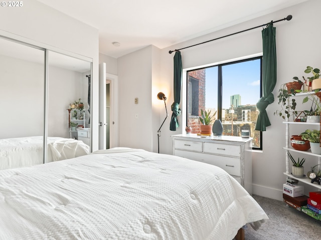 bedroom with carpet floors and a closet