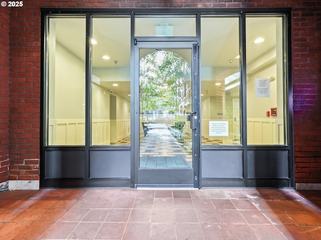 doorway featuring tile patterned flooring