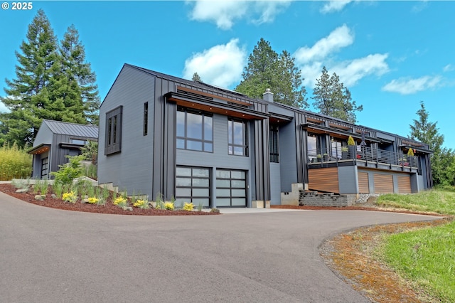 11440 NW Rock Creek Rd, Portland, OR 97231 - modern home featuring driveway and an attached garage