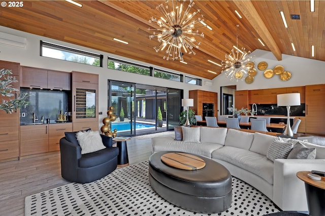 11440 NW Rock Creek Rd, Portland, OR 97231 - living room with a chandelier, light wood-style floors, wood ceiling with exposed beams, and high vaulted ceiling