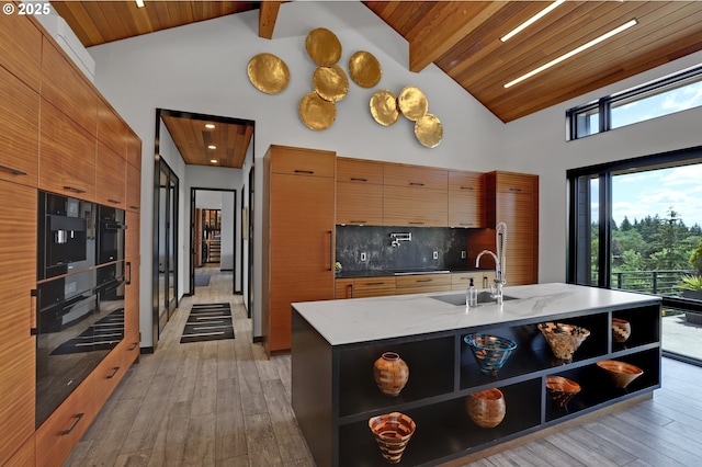 11440 NW Rock Creek Rd, Portland, OR 97231 - kitchen featuring open shelves, modern cabinets, a sink, light wood-style floors, and wood ceiling with exposed beams